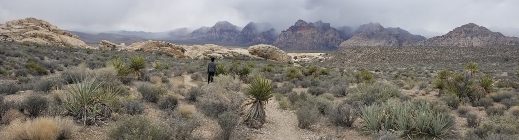 Panorama of Red Rock Canyon. The clouds are on top of the mountain peaks.